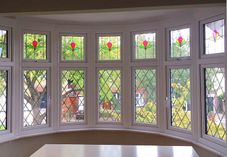 Bow bay window with feature leads and stains